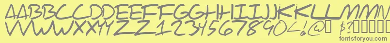 フォントScraotc – 黄色の背景に灰色の文字