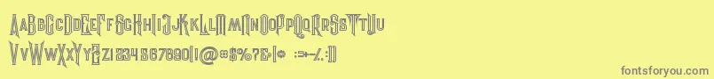 Evolveinline-fontti – harmaat kirjasimet keltaisella taustalla