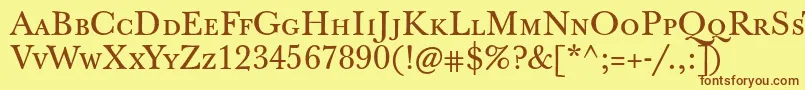 フォントJbaskervilletcaps – 茶色の文字が黄色の背景にあります。