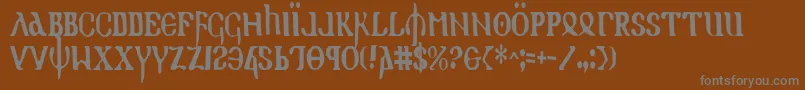 Holyv2c-fontti – harmaat kirjasimet ruskealla taustalla