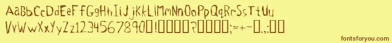 フォントTetanus – 茶色の文字が黄色の背景にあります。