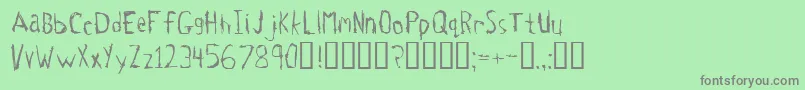 フォントTetanus – 緑の背景に灰色の文字