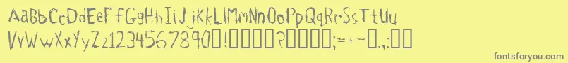 フォントTetanus – 黄色の背景に灰色の文字