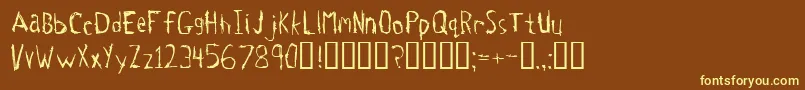Tetanus-fontti – keltaiset fontit ruskealla taustalla