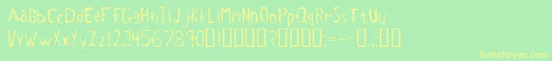 フォントTetanus – 黄色の文字が緑の背景にあります