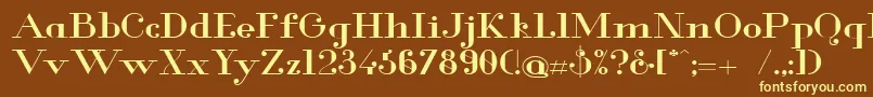 Glamor Mediumextended-fontti – keltaiset fontit ruskealla taustalla