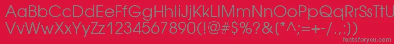 Avantgardegothicgtt-Schriftart – Graue Schriften auf rotem Hintergrund