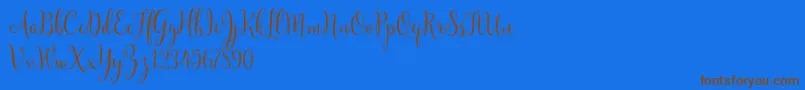 YulindaScriptDemo Font – Brown Fonts on Blue Background