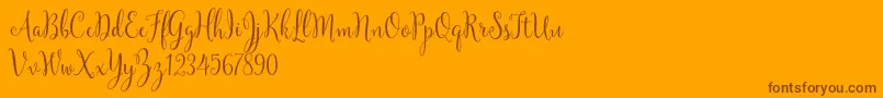 YulindaScriptDemo Font – Brown Fonts on Orange Background