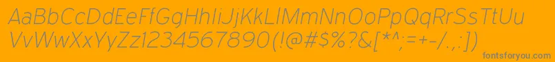 ExpresswayxlItalic-Schriftart – Graue Schriften auf orangefarbenem Hintergrund