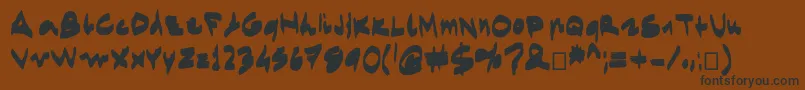 Egidovalmarkerfont-Schriftart – Schwarze Schriften auf braunem Hintergrund