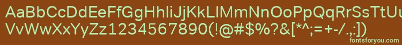 フォントTondocorpRegular – 緑色の文字が茶色の背景にあります。