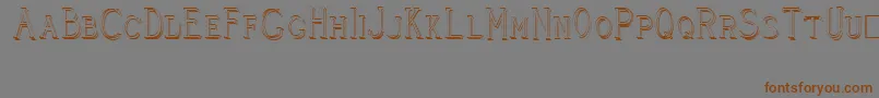 CleaversJuveniaRaised Font – Brown Fonts on Gray Background