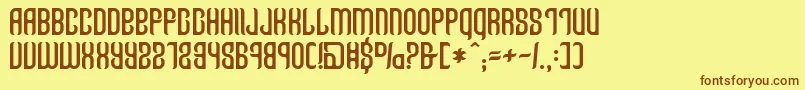 フォントTalismanica – 茶色の文字が黄色の背景にあります。