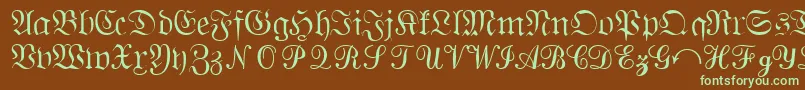 フォントQuantapisixsskRegular – 緑色の文字が茶色の背景にあります。