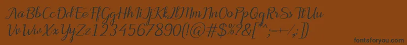Lisätietoja MotiraItalic-fontista MotiraItalic-fontti – mustat fontit ruskealla taustalla