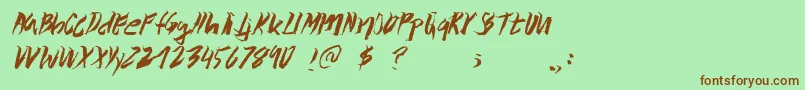 Wolvos Font – Brown Fonts on Green Background