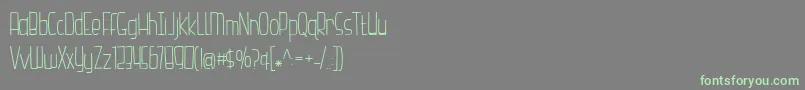 フォントHazelnutWaterLight – 灰色の背景に緑のフォント