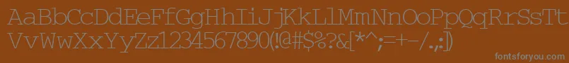 Typew6-fontti – harmaat kirjasimet ruskealla taustalla