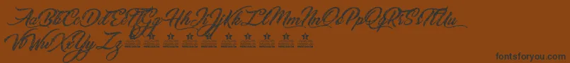 SketchingStarsPersonalUse Font – Black Fonts on Brown Background