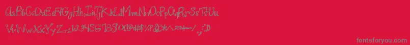 Juicyrags-fontti – harmaat kirjasimet punaisella taustalla