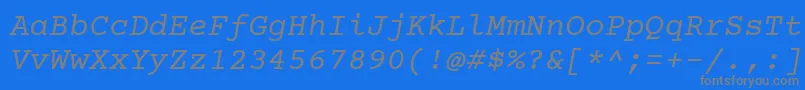 Czcionka Courierprime Italic – szare czcionki na niebieskim tle