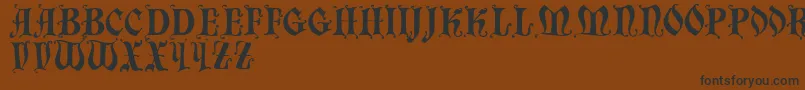 Chaillot-Schriftart – Schwarze Schriften auf braunem Hintergrund