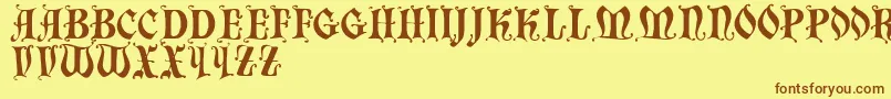 フォントChaillot – 茶色の文字が黄色の背景にあります。