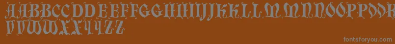 フォントChaillot – 茶色の背景に灰色の文字