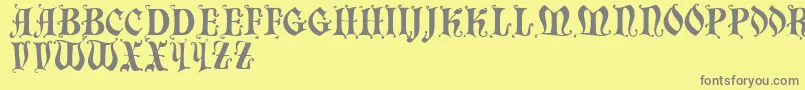 Chaillot-fontti – harmaat kirjasimet keltaisella taustalla