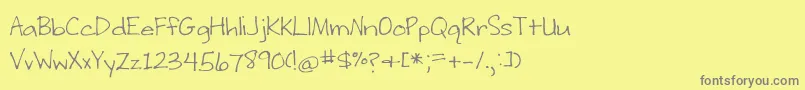 Fonte BmdWritingStuff – fontes cinzas em um fundo amarelo