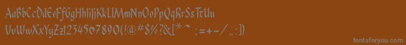 Pendragonflf-fontti – harmaat kirjasimet ruskealla taustalla