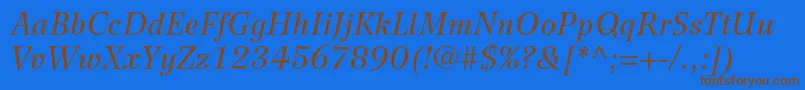 WilkeltstdItalic-Schriftart – Braune Schriften auf blauem Hintergrund