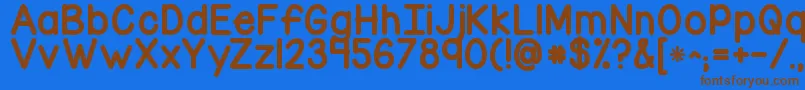 フォントKgcornerofthesky – 茶色の文字が青い背景にあります。