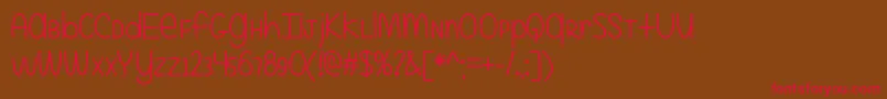 EvenMoreMixedUpOtf Font – Red Fonts on Brown Background