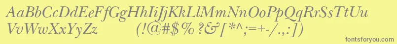 NewbaskervilleexpodcItalic-fontti – harmaat kirjasimet keltaisella taustalla