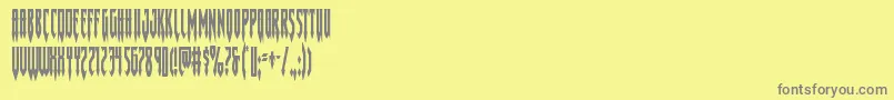 フォントGotharcticacond – 黄色の背景に灰色の文字