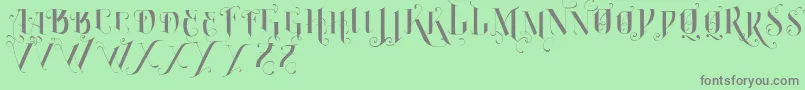 VtksBurning-Schriftart – Graue Schriften auf grünem Hintergrund