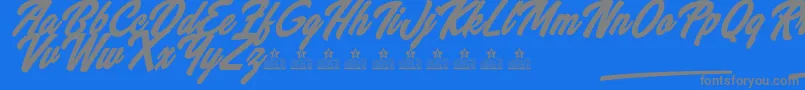 WannabeesPersonalUse-Schriftart – Graue Schriften auf blauem Hintergrund