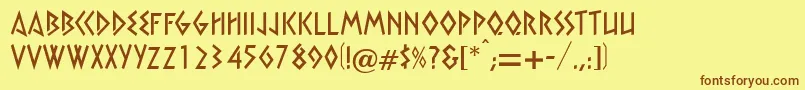 フォントXebec – 茶色の文字が黄色の背景にあります。