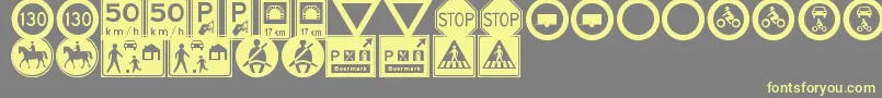 フォントTrafficSignsTfb – 黄色のフォント、灰色の背景