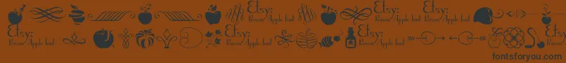 PoisonAppleOrnaments1Demo Font – Black Fonts on Brown Background