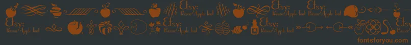 Czcionka PoisonAppleOrnaments1Demo – brązowe czcionki na czarnym tle