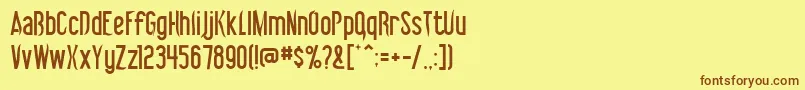 フォントVibrolator – 茶色の文字が黄色の背景にあります。