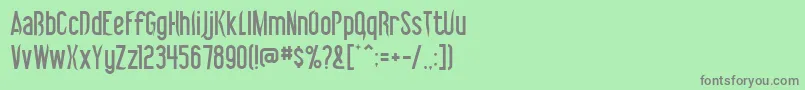 フォントVibrolator – 緑の背景に灰色の文字