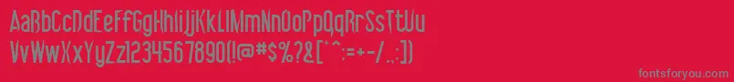 フォントVibrolator – 赤い背景に灰色の文字