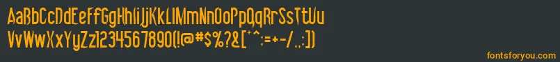 フォントVibrolator – 黒い背景にオレンジの文字