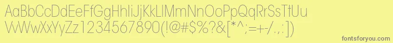 Fonte ItcavantgardestdXltcn – fontes cinzas em um fundo amarelo