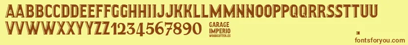 フォントGarageImperio – 茶色の文字が黄色の背景にあります。