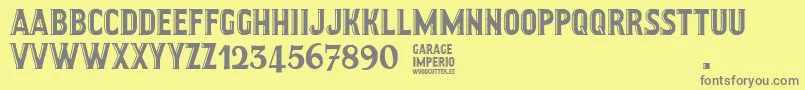 フォントGarageImperio – 黄色の背景に灰色の文字